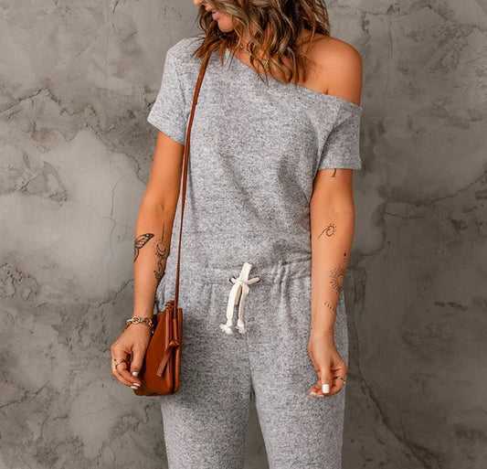 The versatility of the One-Shoulder Drawstring Jumpsuit with Pockets